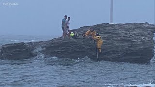 Milford firefighters rescue 4 young men stranded on rock