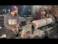 local factory a young man manufacturing process of sugar mill rolls at local factory