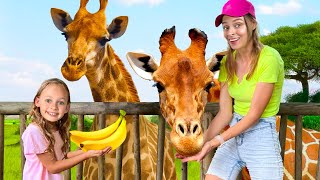 Maya feeds animals at the zoo - Children's song about a family trip