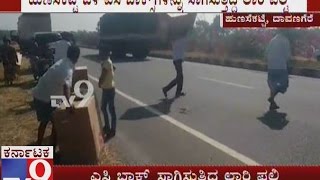 Load lorry falls near davangere | Villagers take AC box to home