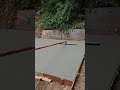 finishing the concrete with a bull float