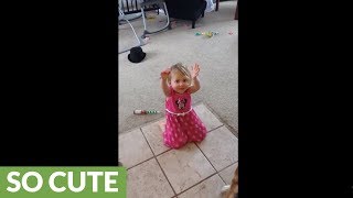 Toddler imitates dog for treats