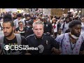 Tuesday sees more peaceful protests as police continue to enforce curfews and crack down on looters