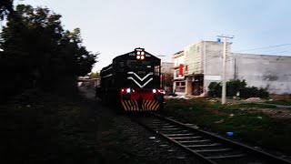 Down lite engine HBU-20 8040 leaving rawalpindi near korang tunnel in rain.