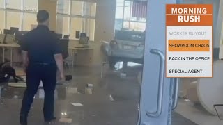Car Drives Through A Carmax Showroom