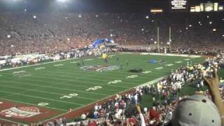 camera flashes at football stadium