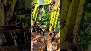 Machine and man excavating together #excavator #construction #shortsvideo