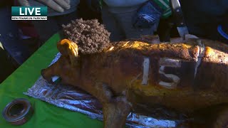 Eagles fan brings roast pig dressed up as Mahomes to the parade