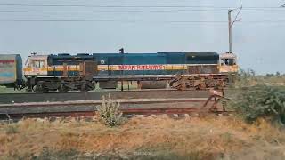 The train race | GANDHIDHAM INDORE Express parallel run with road vehicle