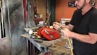 Removing dents from motorcycle gas tank with a water bottle