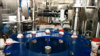 Filling and capping monoblock for topping Monoblocco riempimento tappatura per topping