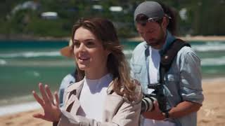 Bella looks over Nikau's beach photoshoot