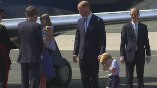 Bless you! Prince George shakes off sneeze as royals are welcomed to Germany