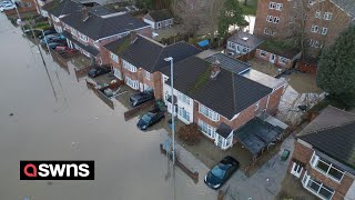 Families trapped in flooded homes after canal bursts its banks during Storm Henk | SWNS