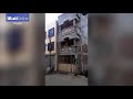 sudden collapse of three storey building caught on camera daily mail