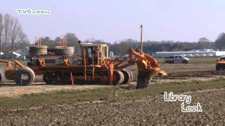 Trenchless drain installation with a vertical plough