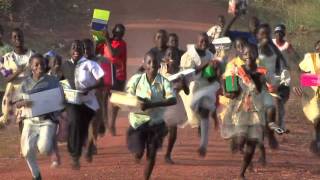 Children in Uganda Run with Shoe Boxes - Operation Christmas Child