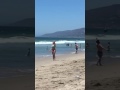 Jenna Bandy throws vortex nerf football across the beach