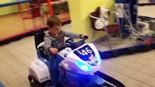 Kids playing with cars at indoor playground. Funny video