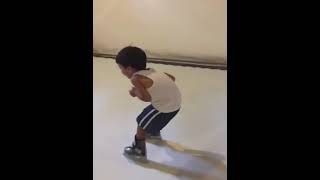 A 3 year old skating on synthetic ice, for his first time