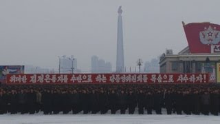 「新年の辞」貫徹で集会 平壌、ロケット宣伝画も