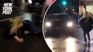 Video shows woman sent flying after being hit by car doing donuts in LA street takeover