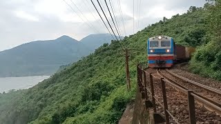 D19E - 905 pulled container train run along the sea