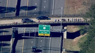 Crowd gathers along interstate for Jimmy Carter motorcade | Aerials