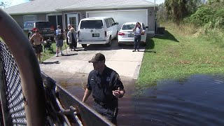 Tampa officers, firefighters rescue residents trapped by flooding
