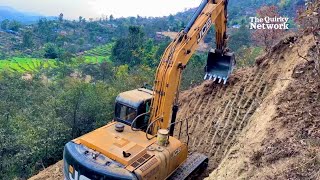 Constructing a Hilltop Road with a JCB Excavator