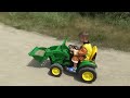 truck stuck in the mud rubble ride on power wheels tractor to help