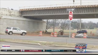 Construction workers ask drivers, "Be careful in work zones."