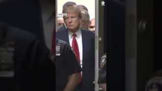 Former Pres. Trump enters a Manhattan courtroom after being processed as a criminal defendant.