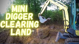 Clearing land area with a Yanmar sv17ex mini excavator