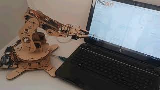 Inverse kinematic controlled laser cut robot arm