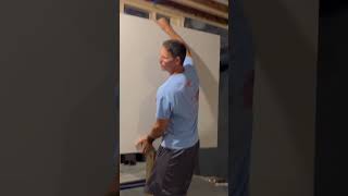 Finally built a wall to enclose the home gym. Neat little trick to hang drywall alone.