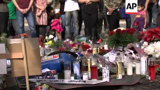 A makeshift memorial for actor Paul Walker continues to grow as hundreds of people visit the spot wh