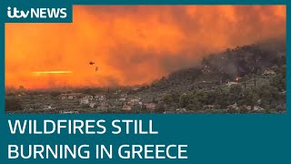 Greece wildfires: Thousands flee homes in Athens amid heatwave | ITV News