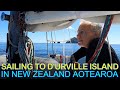 Sailing to D'urville Island Close to Rocks and Sea Arches in the Marlborough Sounds of New Zealand