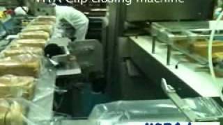 HOBA - Bread Slicer HSA-2, Bagger HBR baghand robot, Closing conveyor with clipband HTA-15