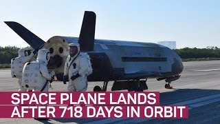 Secretive space plane lands after 718 days circling Earth (CNET News)