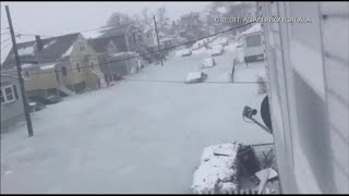 Frozen floodwaters trap vehicles in storm-battered Massachusetts