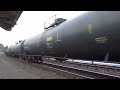 northbound bnsf loaded oil train passes through the steilacoom ferry terminal.