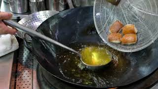 Chef Joe Chan prepares his suckling pork toast in restaurant Sun Tung Lok, Hong Kong