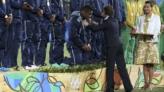 Fijian rugby gold medallists kneel respectfully for Princess Anne