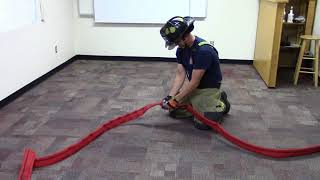 Skill Drill 15-4: Performing the one FF Knee-Press Method of Uncoupling a Fire Hose
