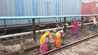 Women workers on Baroda's railway tracks: People work at Vadodara railway station in Gujarat