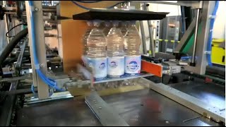 Excellent water bottle packing solution! Prasmatic TC 400 Combination case packer by Robopac USA