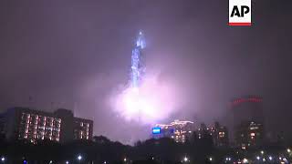 Crowds cheer NYE fireworks at Taipei 101 Tower