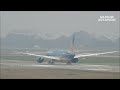 the plane carrying the aff cup championship trophy and the national team back to vietnam vn a871